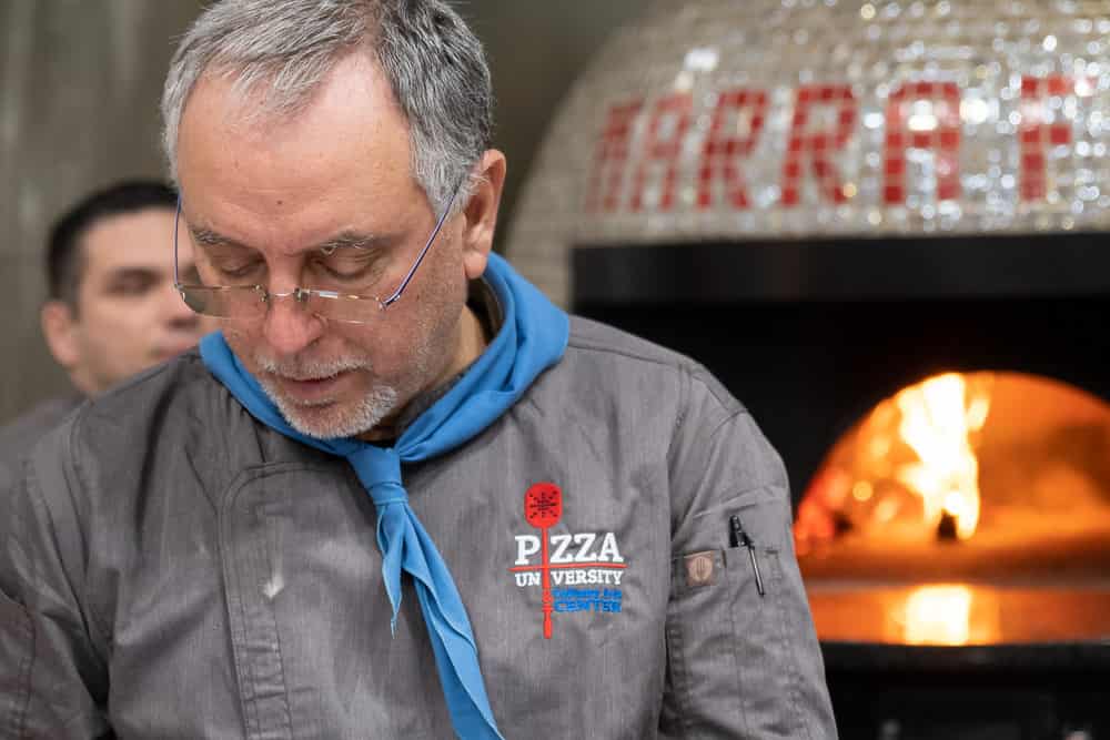 Italian Pizza Chef in front of Marra Forni wood fired oven